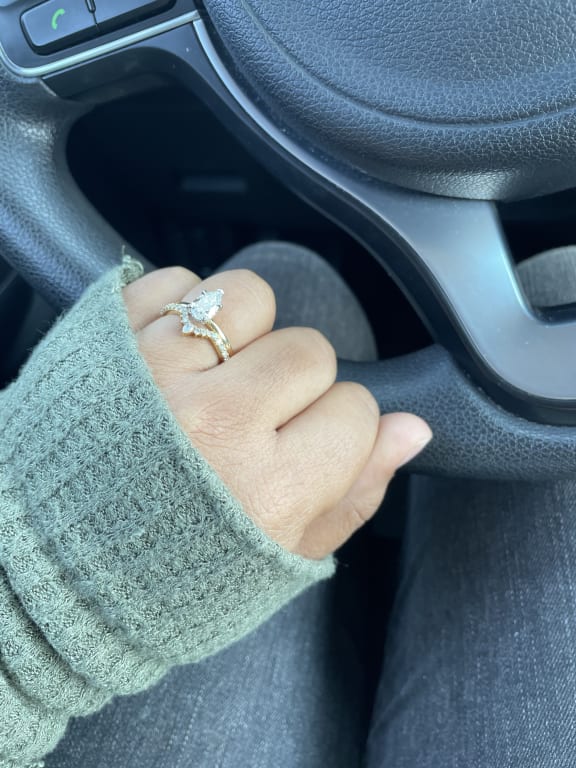 Oval diamond ring on hand