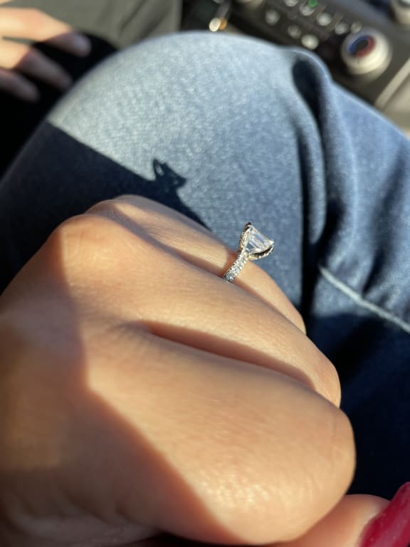 Oval diamond ring on hand
