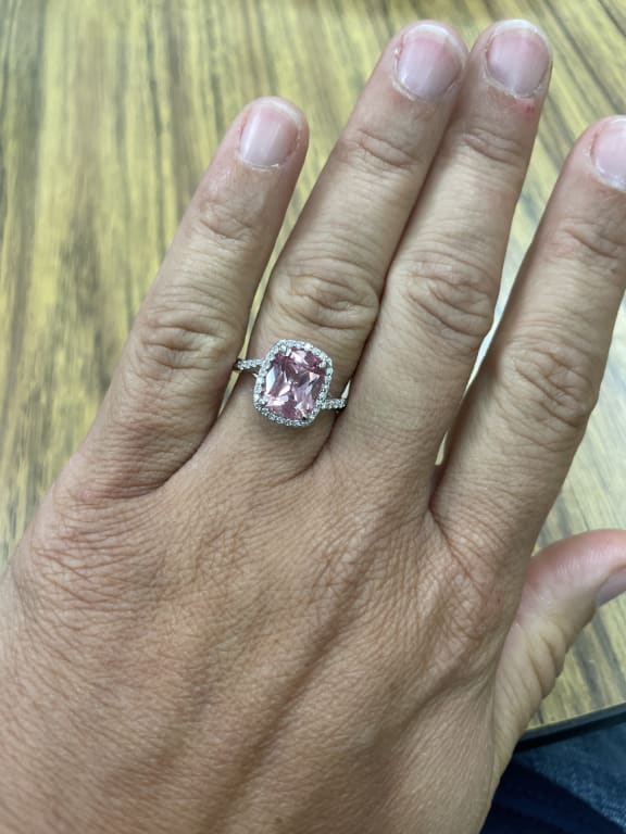 Oval diamond ring on hand
