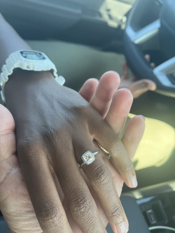 Oval diamond ring on hand