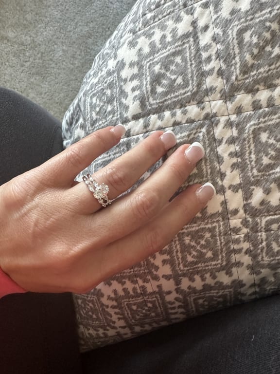 Oval diamond ring on hand
