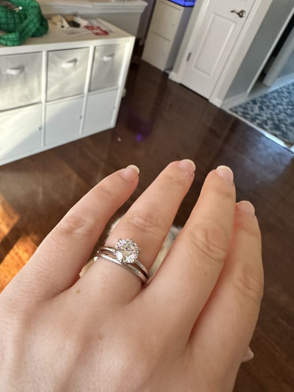 Oval diamond ring on hand