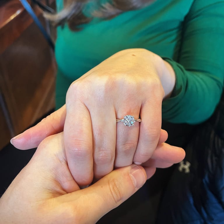 Oval diamond ring on hand