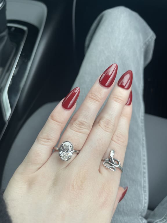 Oval diamond ring on hand