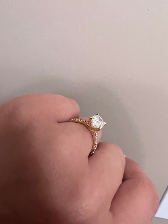 Oval diamond ring on hand