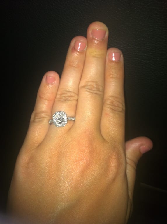 Oval diamond ring on hand