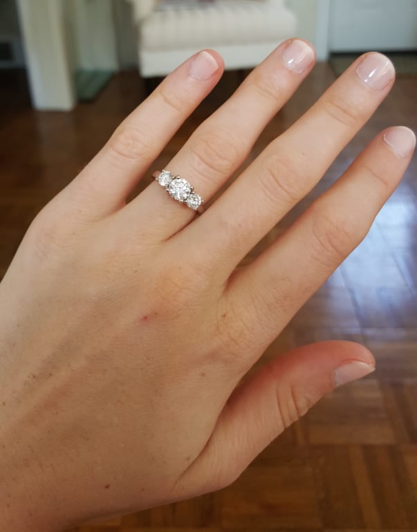 Oval diamond ring on hand