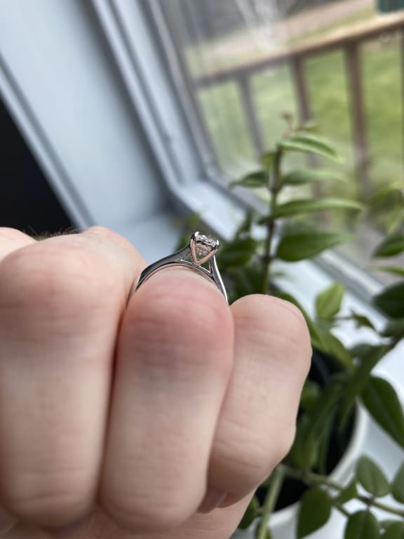 Oval diamond ring on hand