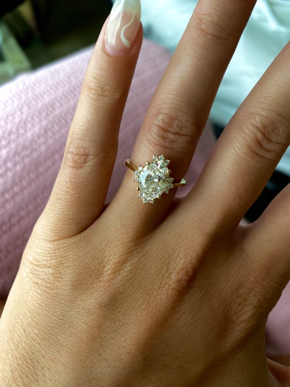 Oval diamond ring on hand
