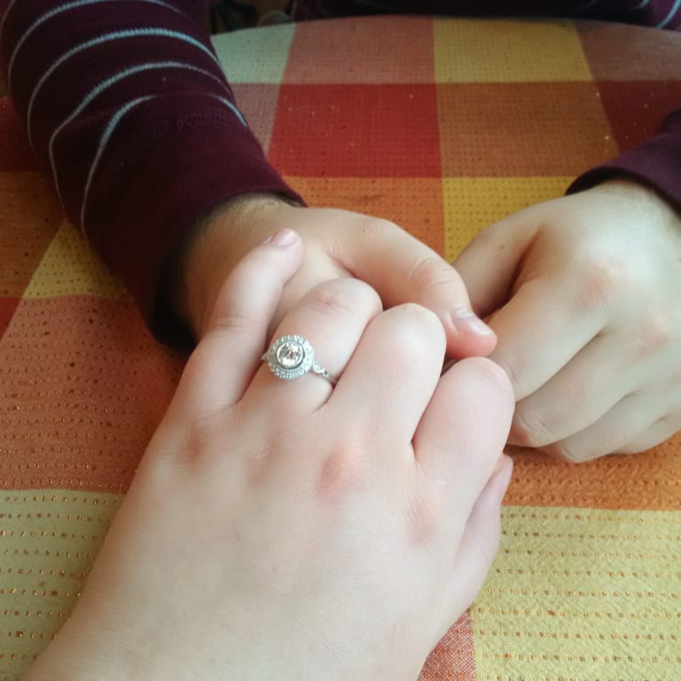Oval diamond ring on hand