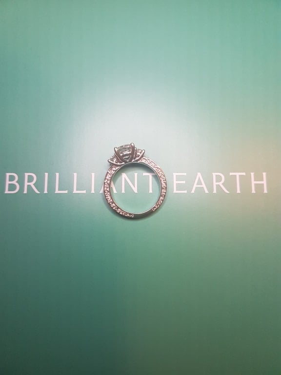 Oval diamond ring on hand