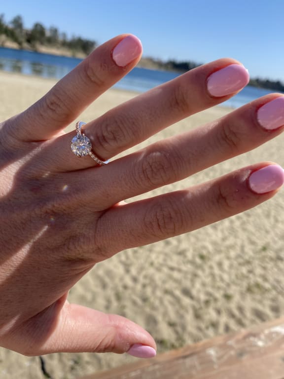 Oval diamond ring on hand