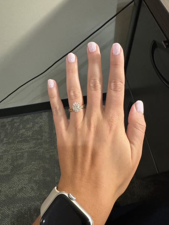 Oval diamond ring on hand