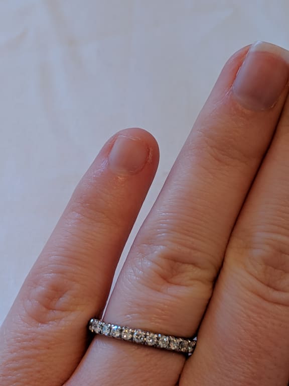 Oval diamond ring on hand