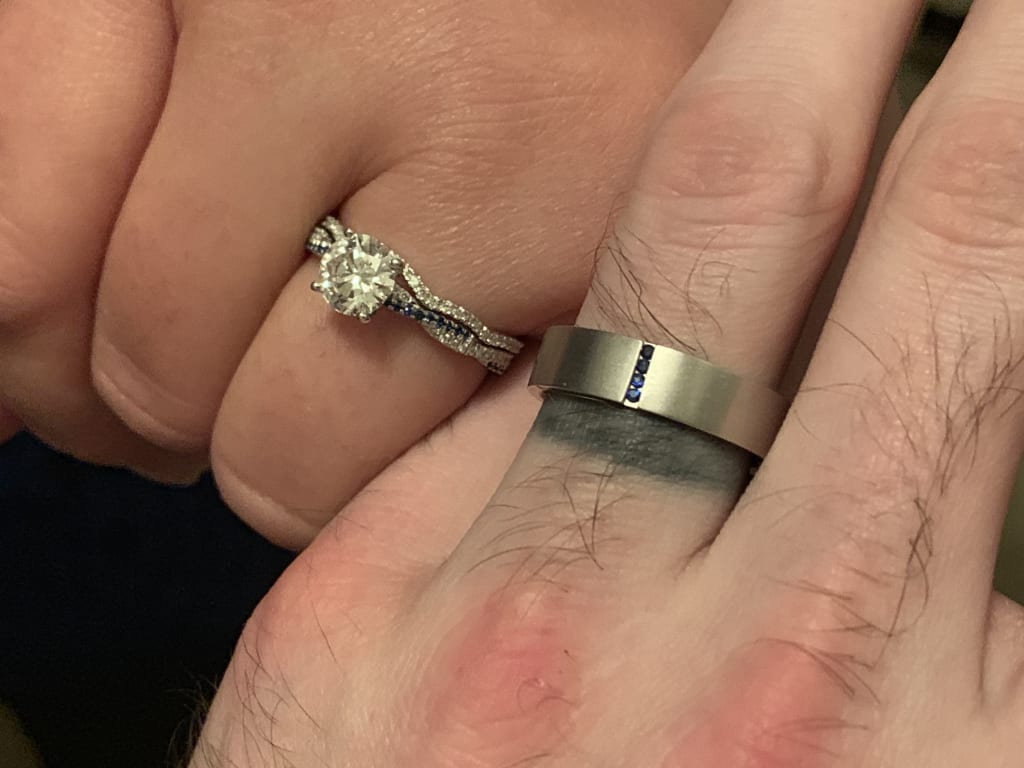 Oval diamond ring on hand