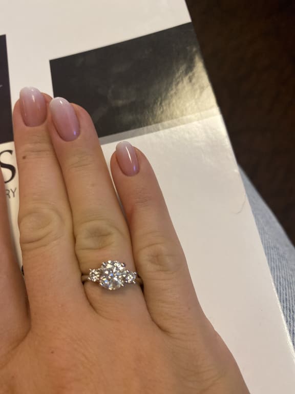 Oval diamond ring on hand