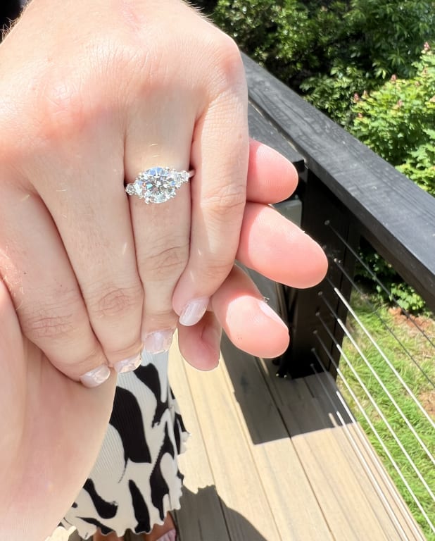 Oval diamond ring on hand