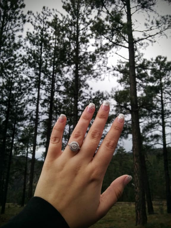 Oval diamond ring on hand