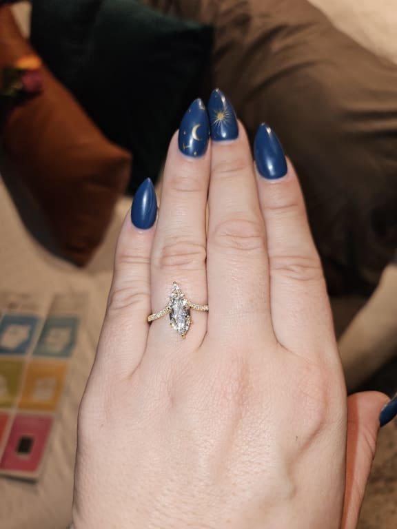 Oval diamond ring on hand
