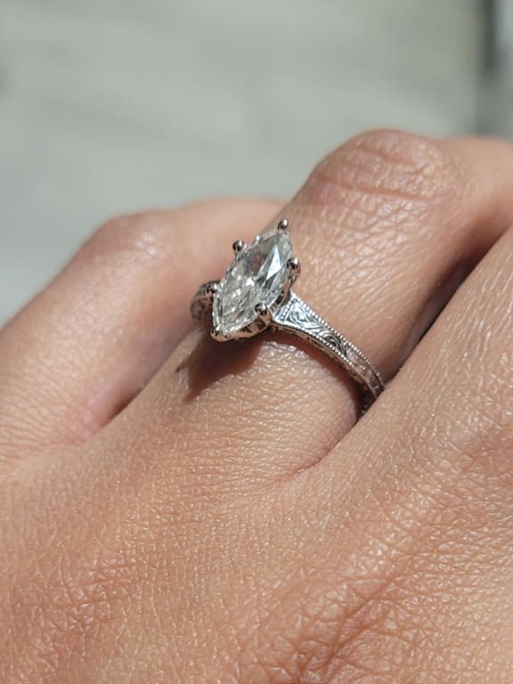 Oval diamond ring on hand