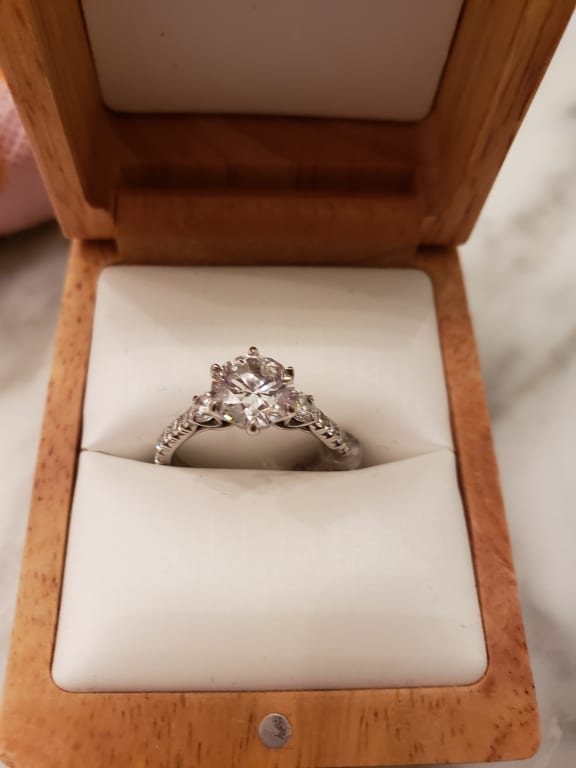 Oval diamond ring on hand