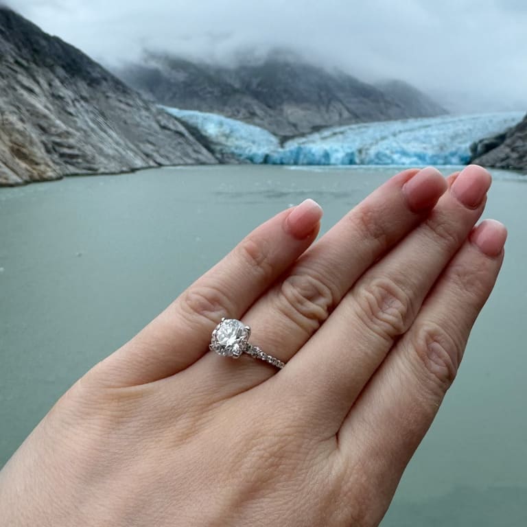 Oval diamond ring on hand