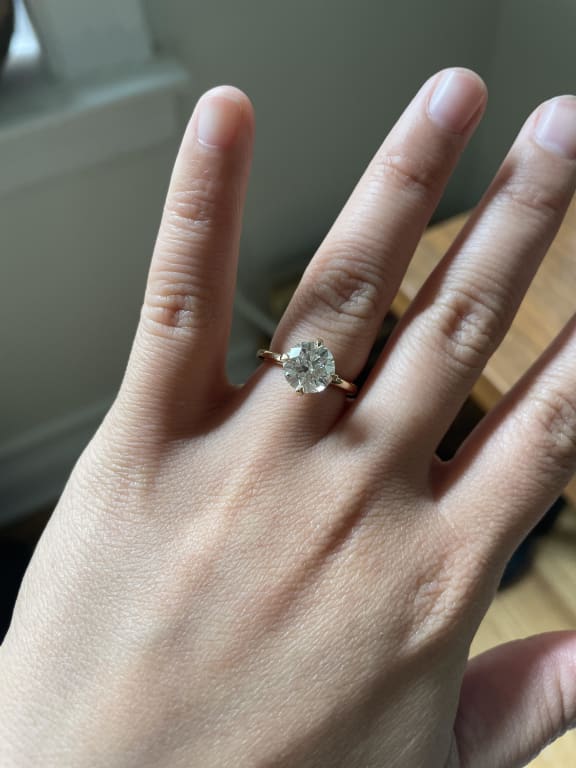 Oval diamond ring on hand