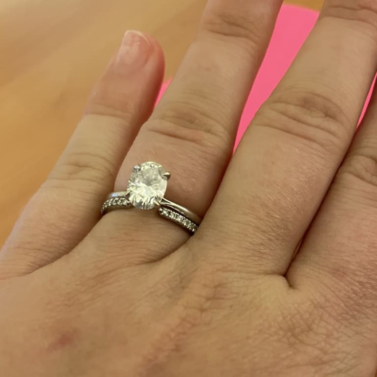 Oval diamond ring on hand