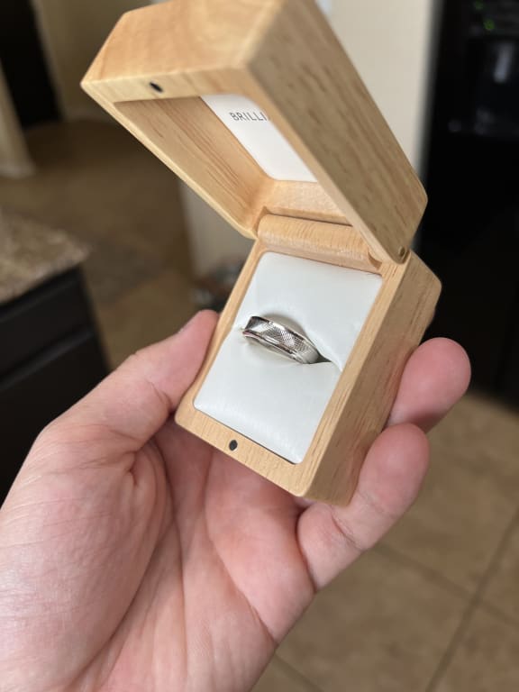 Oval diamond ring on hand