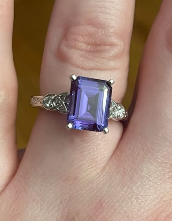 Oval diamond ring on hand