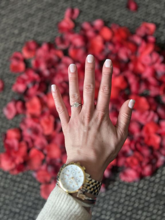 Oval diamond ring on hand