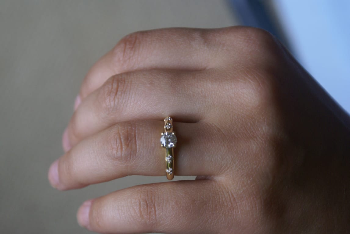 Oval diamond ring on hand
