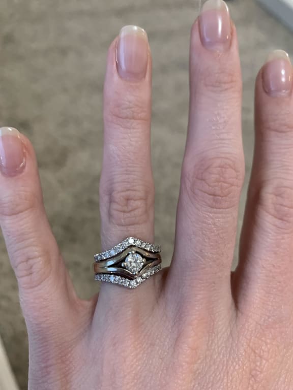 Oval diamond ring on hand