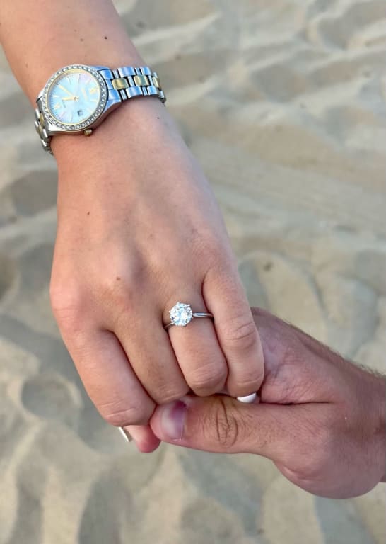 Oval diamond ring on hand