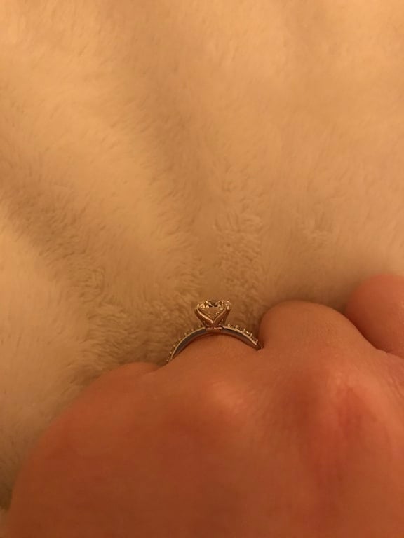 Oval diamond ring on hand
