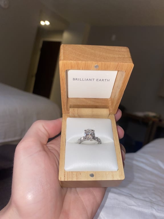 Oval diamond ring on hand