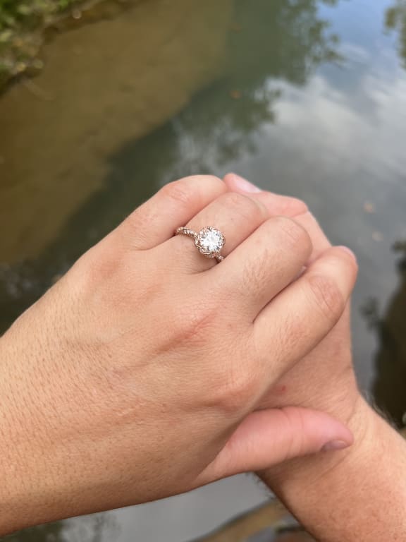 Oval diamond ring on hand