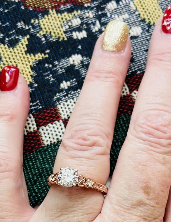 Oval diamond ring on hand