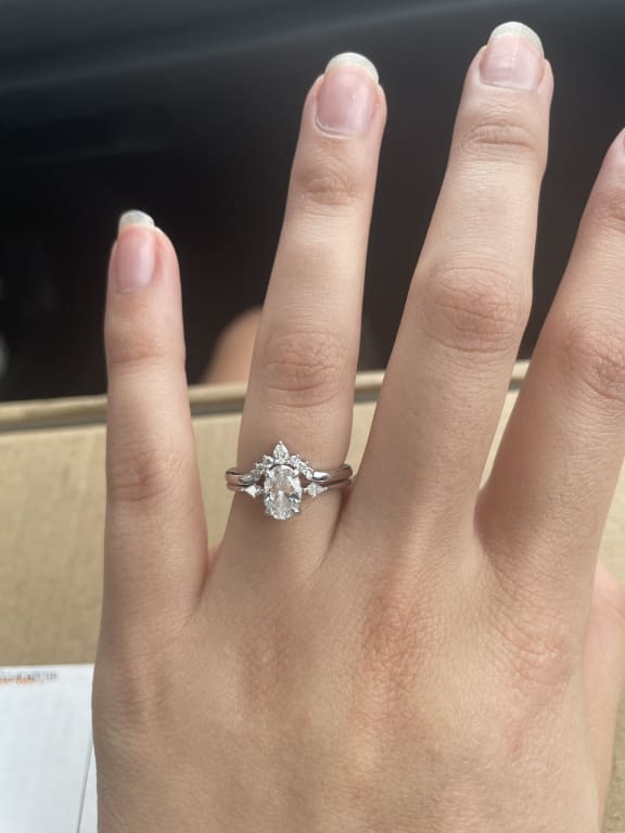 Oval diamond ring on hand