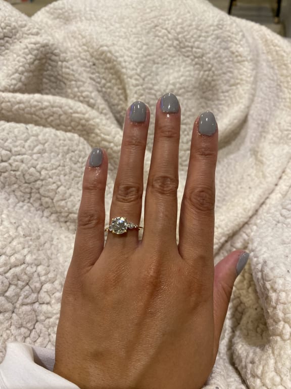 Oval diamond ring on hand