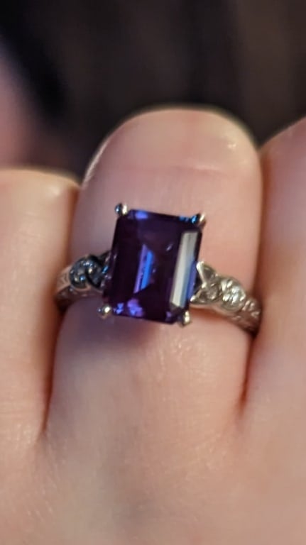 Oval diamond ring on hand