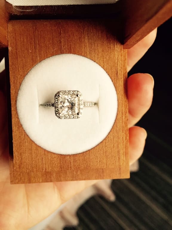 Oval diamond ring on hand