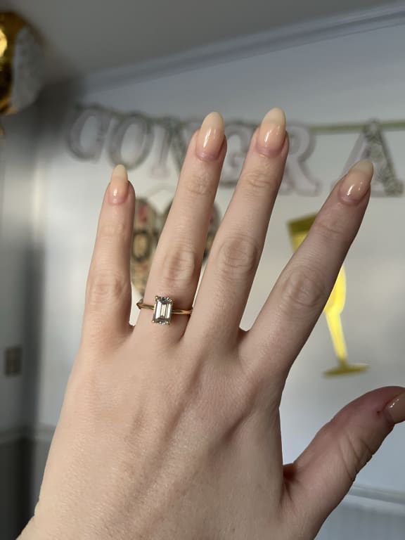 Oval diamond ring on hand