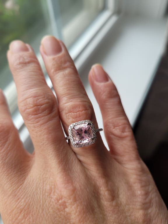 Oval diamond ring on hand
