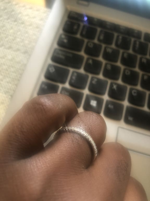 Oval diamond ring on hand