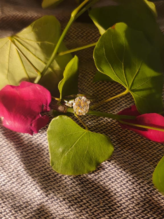 Oval diamond ring on hand