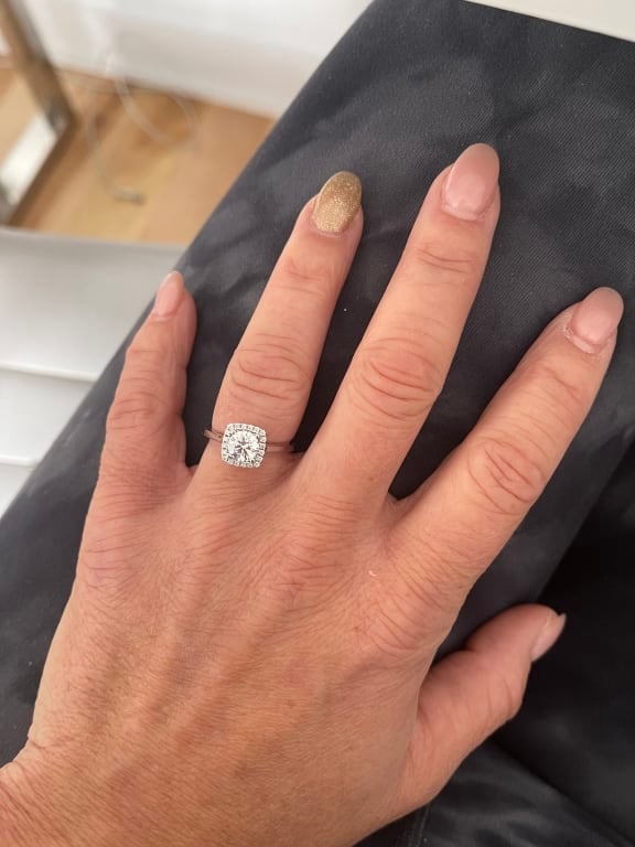 Oval diamond ring on hand