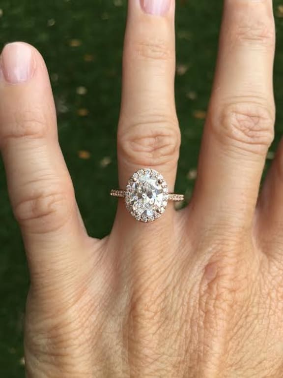 Oval diamond ring on hand