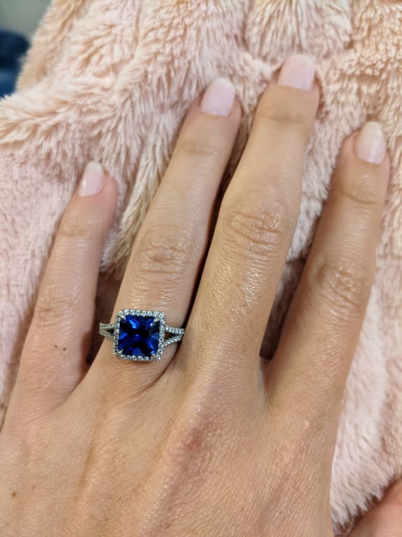 Oval diamond ring on hand