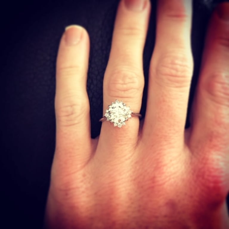 Oval diamond ring on hand